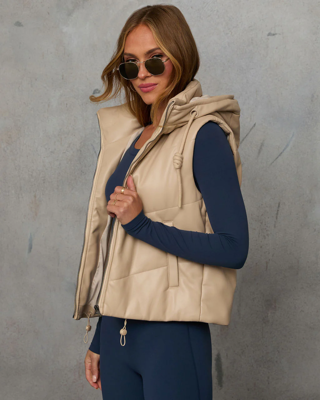 1727-shelton-pocketed-hooded-faux-leather-puffer-vest-1.webp
