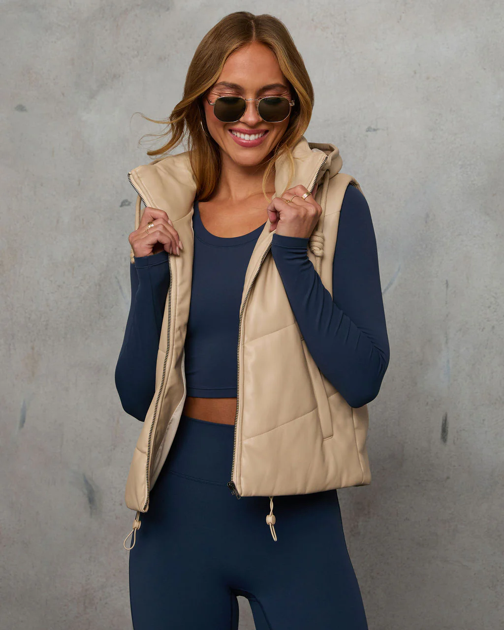 1727-shelton-pocketed-hooded-faux-leather-puffer-vest-1.webp