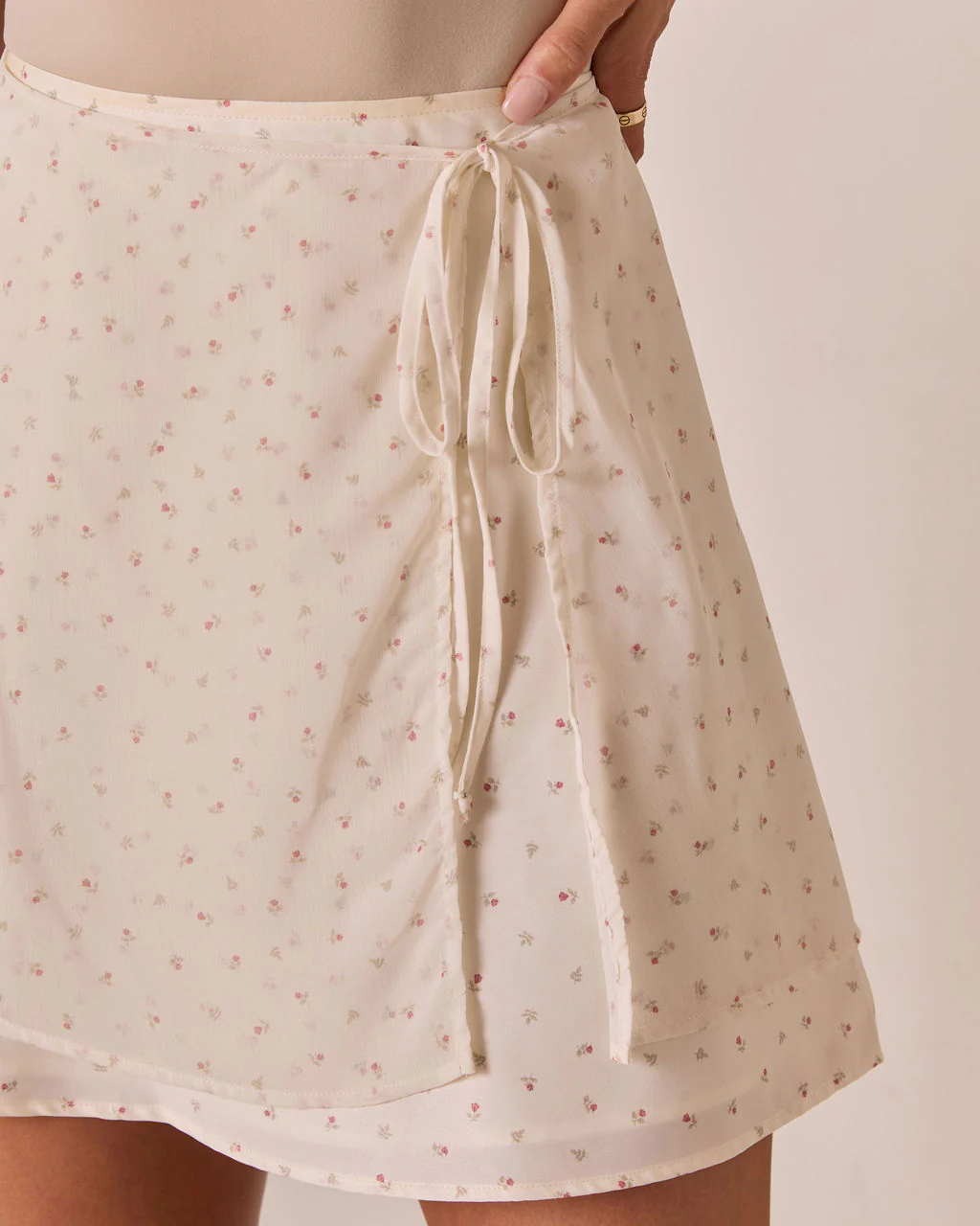 3345-larke-floral-wrap-mini-skirt-1.webp