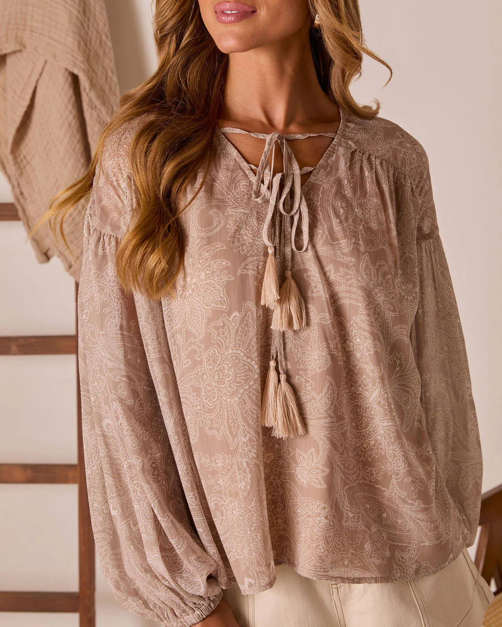 40118-eminah-front-tie-peasant-top-1.webp
